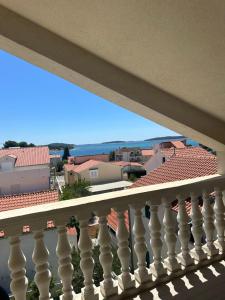 a balcony with a view of a town at Villa Dragic in Brodarica