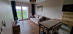 Posezení v ubytování Sunrise Apartament w Krakowie