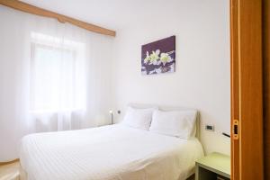 Postel nebo postele na pokoji v ubytování Residenza Garibaldi
