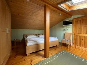 Postel nebo postele na pokoji v ubytování Ferienhaus Negast