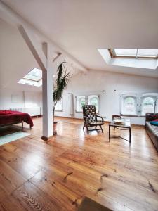 a large living room with a couch and a table at Herrenhaus Libnow in Murchin