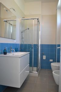 a bathroom with a shower and a sink and a toilet at Porticciolo in San Vito +31 photos