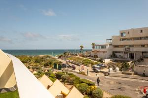 a view of the ocean from a building at Addict Heliopolis Luxury and Sensual Apartment in Cap d'Agde