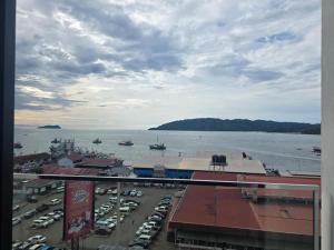 a view of a harbor with boats in the water at The shore by seffa2 in Kota Kinabalu