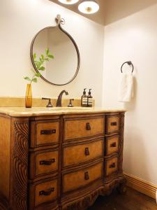 a bathroom with a sink and a mirror at Modern Cabin, Secluded, Views, Lake, Private Dock, WIFI in Topton +24 photos