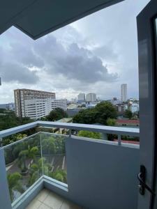 a balcony with a view of a city at Modern Spacious 2BR 68 sqm Condo in Manhattan Heights Pool View in Manila +25 photos