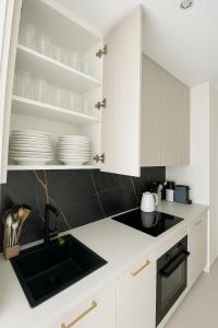 Kuchyň nebo kuchyňský kout v ubytování Tężnia & Augustów - 24h Apartamenty - Klimatyzacja - Parking