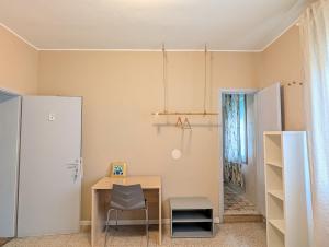a room with a table and a chair at Locanda San Marco in Caorle