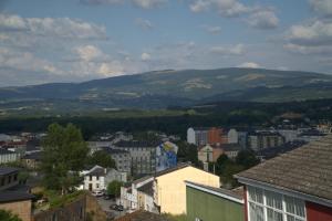 a view of a city with mountains in the background at Apartamento El Castillo VT1 in Sarria