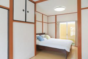 Ένα ή περισσότερα κρεβάτια σε δωμάτιο στο 花の宿