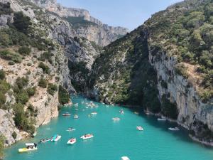 a group of boats in a river in a canyon at Maison Romana in Riez