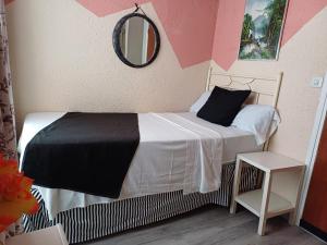 Ein Bett oder Betten in einem Zimmer der Unterkunft Hospedaje Botin