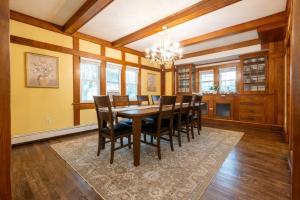 a dining room with a table and chairs at Beechmont-Charming Colonial for Events and Getaways! in Bridgeport