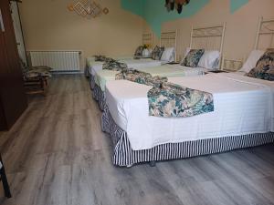 Ein Bett oder Betten in einem Zimmer der Unterkunft Hospedaje Botin