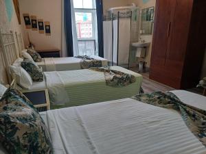 Ein Bett oder Betten in einem Zimmer der Unterkunft Hospedaje Botin