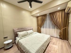 a bedroom with a bed and a ceiling fan at White House - Alor Setar in Alor Setar +16 photos