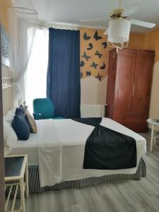Ein Bett oder Betten in einem Zimmer der Unterkunft Hospedaje Botin