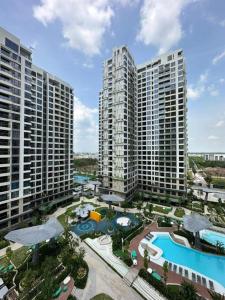 an aerial view of tall buildings with a swimming pool at Origami Vinhomes Grand Park Q9 in Gò Công