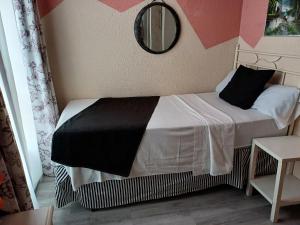 Ein Bett oder Betten in einem Zimmer der Unterkunft Hospedaje Botin