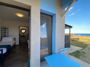 a bedroom with a bed and a view of the ocean at Sea Side in Vama Veche +15 photos