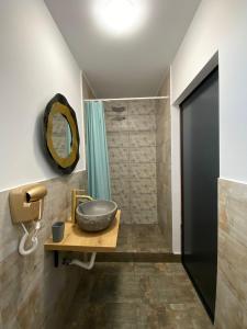a bathroom with a sink and a shower at Sea Side in Vama Veche