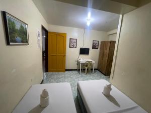 Postel nebo postele na pokoji v ubytování Constrell Pension House