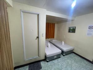 Postel nebo postele na pokoji v ubytování Constrell Pension House