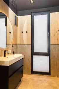 a bathroom with a sink and a window at INOclub in Tatariv +76 photos