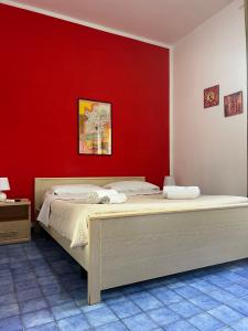 Letto o letti in una camera di Nido Colorato B&B