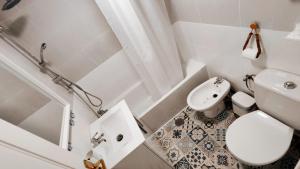 a small bathroom with a toilet and a sink at Apartamento Sabimar Playa in San Luis de Sabinillas +42 photos