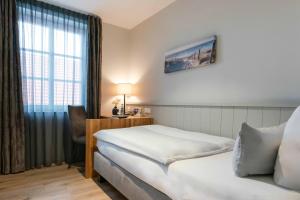 Postel nebo postele na pokoji v ubytování Hotel Friesenhof