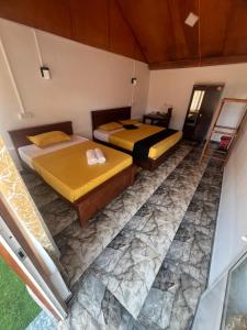 Ein Bett oder Betten in einem Zimmer der Unterkunft Golden Beach Hotel & Restaurant