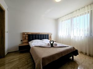 a bedroom with a bed and a window at Villa Green s bazenom in Medulin +51 photos