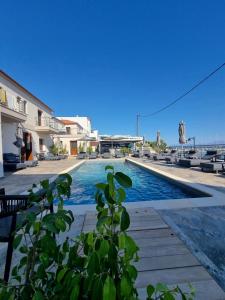 a swimming pool with a view of the ocean at La vie luxury suites in Megalochori