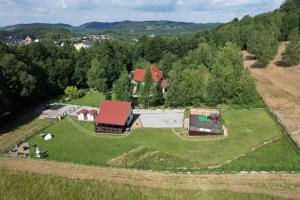 an aerial view of a farm with a barn at Wiśniowe Zacisze - Agroturystyka in Sułkowice