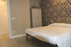 Postel nebo postele na pokoji v ubytování Casa Odino Bilocale