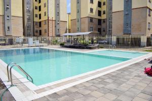 a large swimming pool in front of a building at Davinia Haven in Nairobi