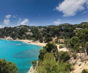 a view of a beach with houses on a hill at Villa Escorpion Tossa de Mar in Tossa de Mar