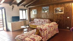 TV a/nebo společenská místnost v ubytování Appartamento Caprioli