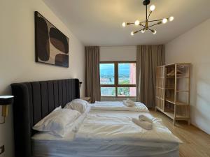 Ένα ή περισσότερα κρεβάτια σε δωμάτιο στο Val Mare