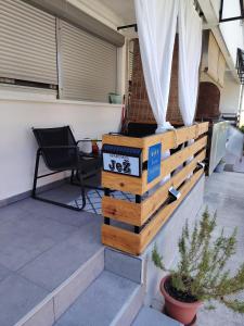 a fence on a patio with a table and a chair at Apartman Jež 4 De Lux - self check in, free parking in Karlovac +2 photos