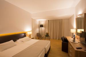 Letto o letti in una camera di Calypso Palace