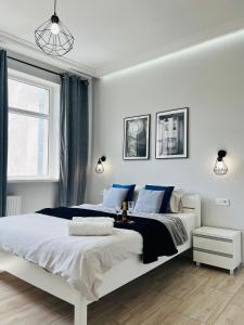 Posteľ alebo postele v izbe v ubytovaní Property Apart - Ruska Centrum