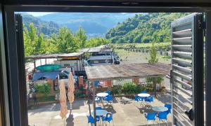a view from a window of a rv and a patio at Sweet Home Aria in Çorovodë