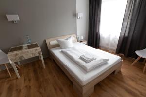 Postel nebo postele na pokoji v ubytování Hotel Dernbach