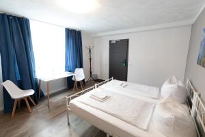 Postel nebo postele na pokoji v ubytování Hotel Dernbach