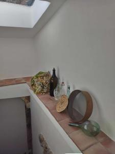 a counter with a mirror and other items on it at Antica Dimora Vaglica in Palermo