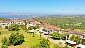 an aerial view of a resort with the ocean in the background at Sandi-Lee's Casa Bella in Plettenberg Bay