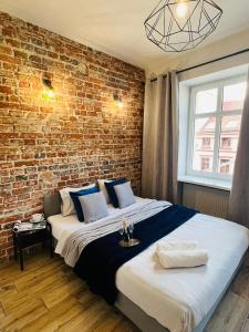 Posteľ alebo postele v izbe v ubytovaní Property Apart - Ruska Centrum