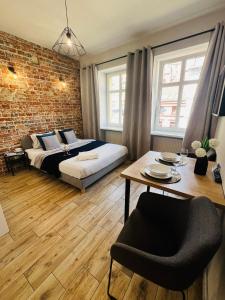 Posteľ alebo postele v izbe v ubytovaní Property Apart - Ruska Centrum